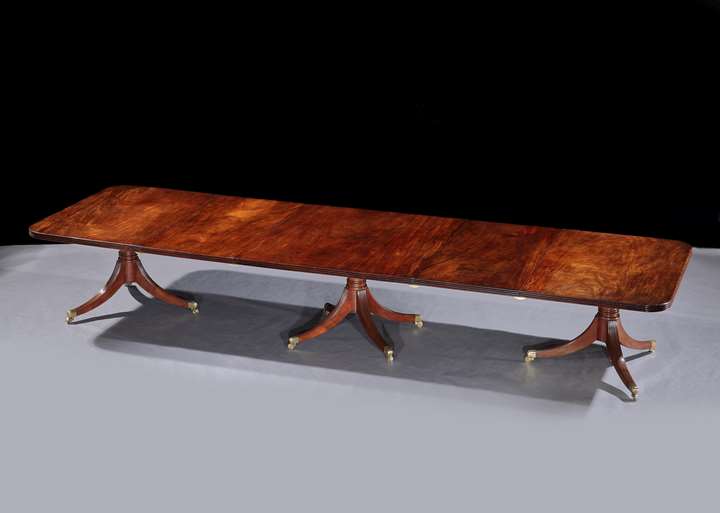 An Irish George III mahogany three pillar dining table